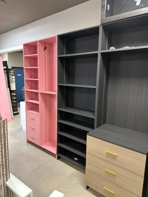 Walk-in closet system with shelving, drawers and hanging rods installed