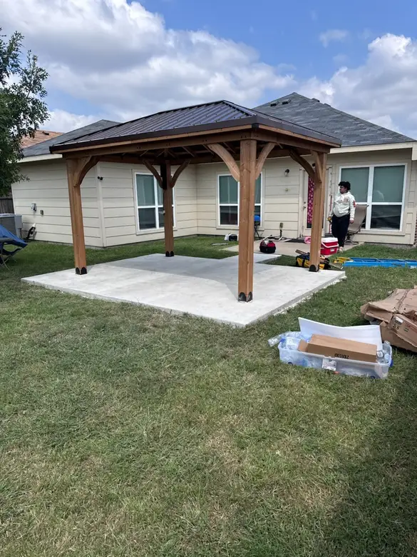 Cedar pavilion going up on a freshly poured concrete slab