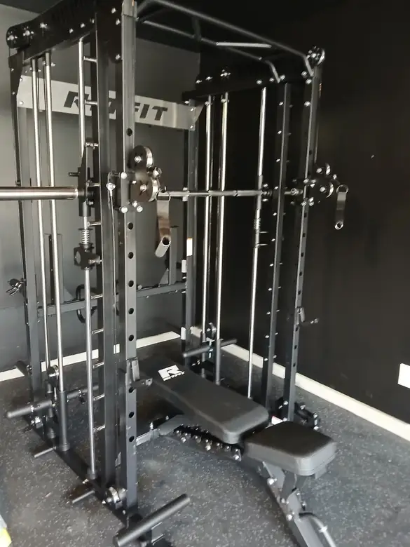 Power rack with a cable stack assembled in a home gym